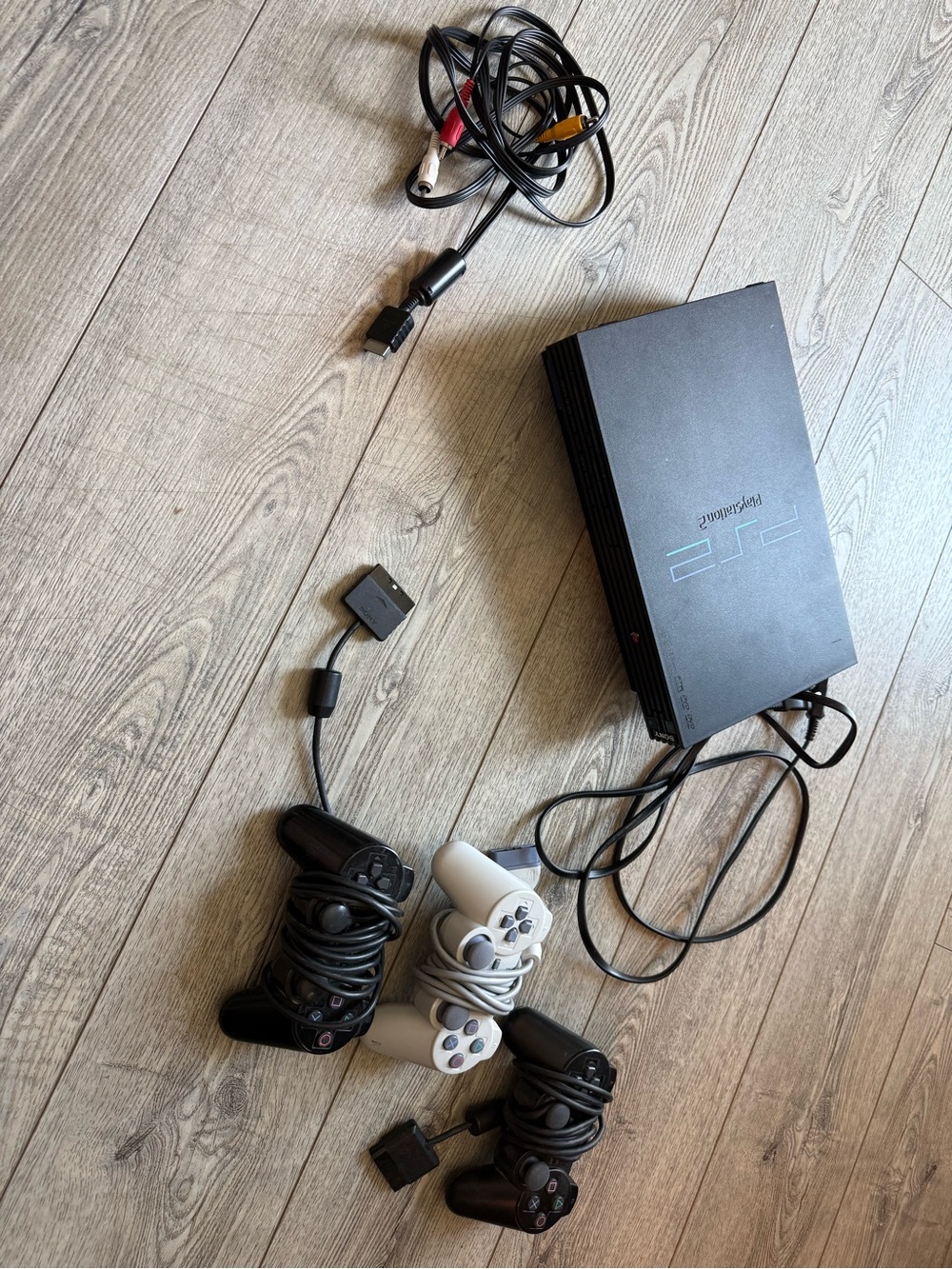 Sony PlayStation 2 Console with Black and White Controllers